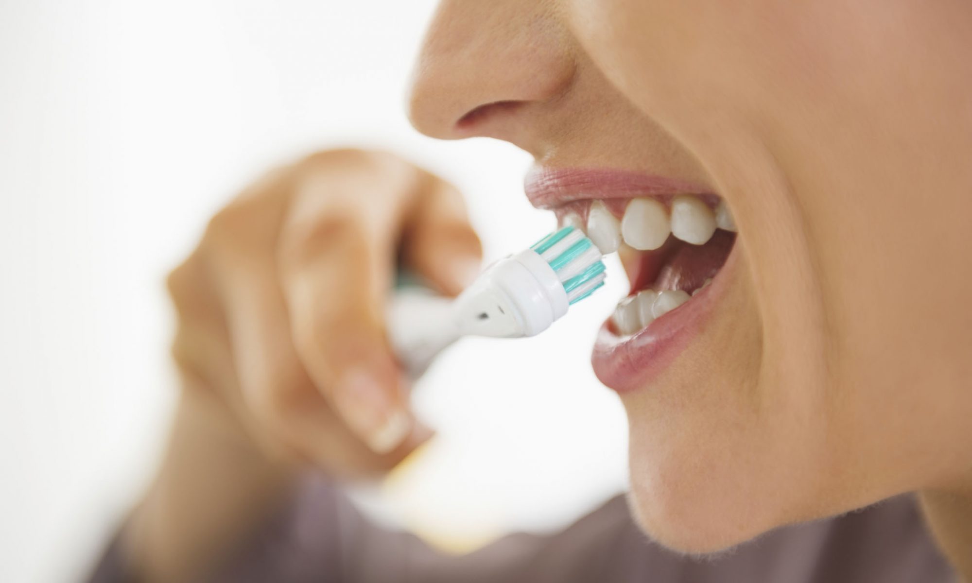 woman brushing teeth